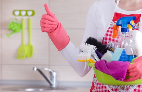 Cleaner wearing PPE while working in a Brompton property